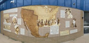 Mural depicting a map of North America focusing on the southwestern region, with historical figures